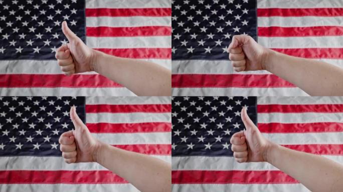 在模糊的美国国旗前用白人的手竖起大拇指