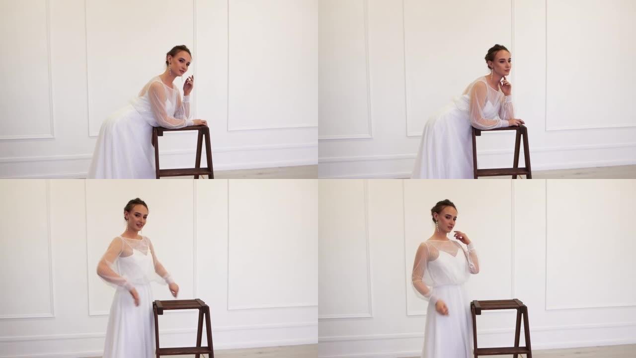 一个穿着白色婚纱的女孩靠在架子上，优雅地摆姿势。