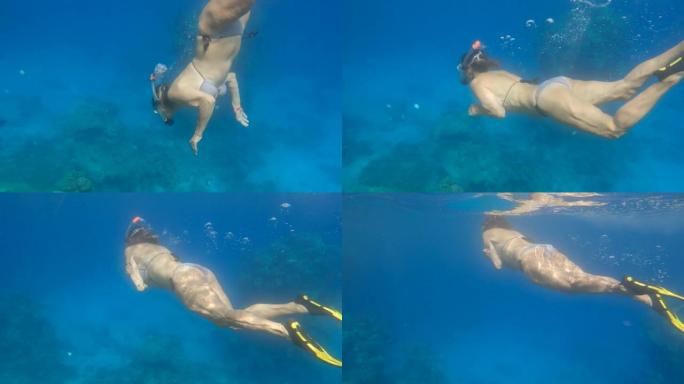 戴着面具和鳍的女人潜入水下，掉入一层冷水中。女性浮潜者颤抖着撞到温跃层 (热层或金属离子) 并迅速出