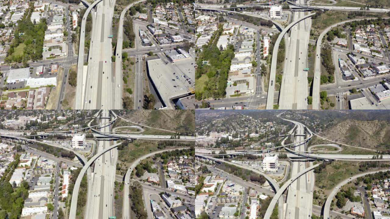 洛杉矶多层高速公路上行驶的汽车的美丽鸟瞰图。