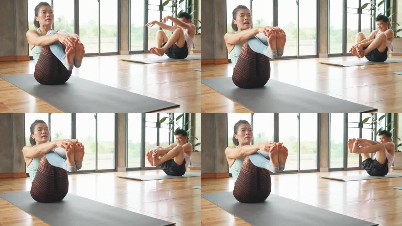 东南亚人健身并练习瑜伽锻炼