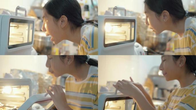 亚洲女孩打开烤箱，独自在家里的厨房里闻到自制烤鸡的味道，生活方式的概念。