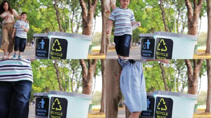 两个孩子和妈妈在回收站里放了塑料垃圾，以帮助保护环境。