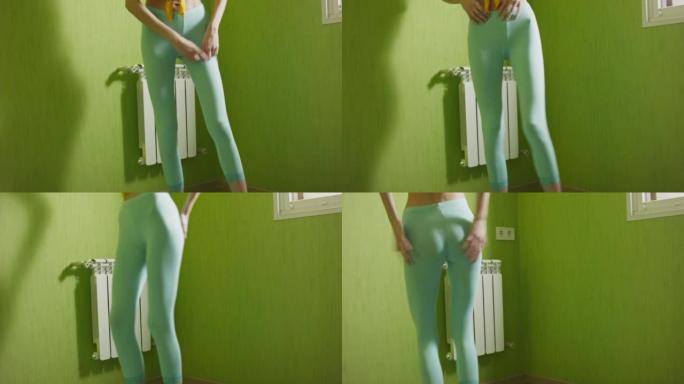 年轻女子训练前在家换绑腿。
