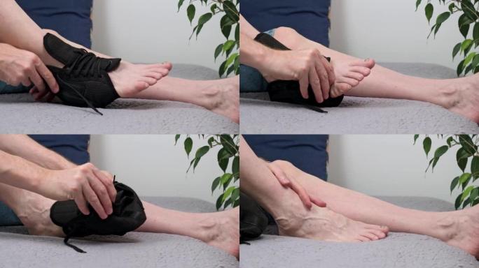 作为一个男人的特写镜头，从脚踝关节区域受伤的腿部去除一条特殊的固定绷带。
