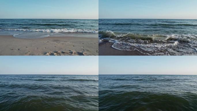 摄像机在平静的海面上飞行。日出的光芒抚摸着平静的海浪。