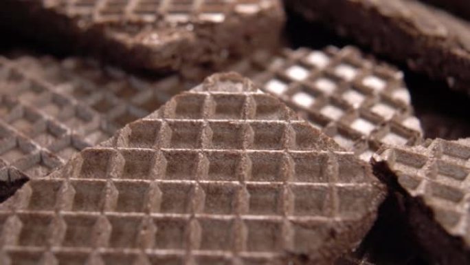 华夫饼棕色巧克力饼干质地。薄饼脆皮表面。华夫饼图案。宏