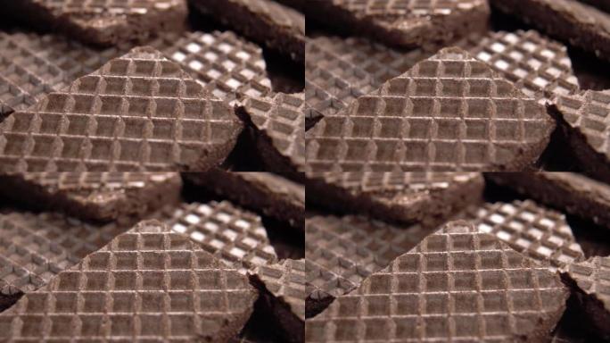 华夫饼棕色巧克力饼干质地。薄饼脆皮表面。华夫饼图案。宏