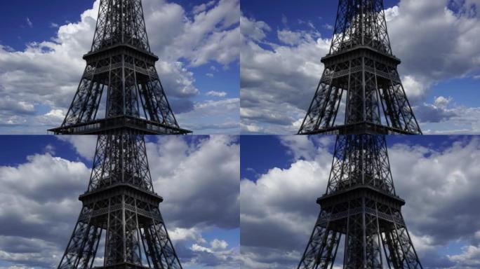 法国巴黎的埃菲尔铁塔 (在移动的云，时间流逝的背景下，用变焦)