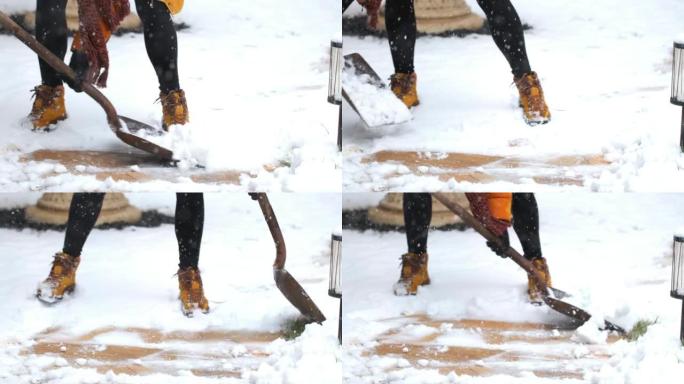 白人年轻女子在冬天在户外铲雪。