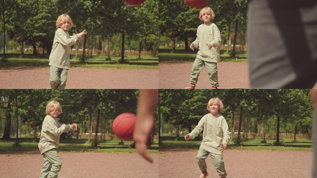 小男孩在户外打篮球