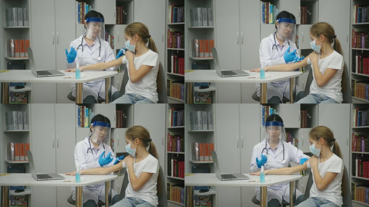 亚洲医生在办公室为戴着面具的金发女孩制作疫苗