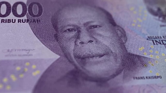 印度尼西亚10000卢比的钞票观察和储备侧特写跟踪多莉拍摄10000印度尼西亚纸币当前10000印度