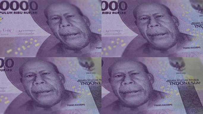 印度尼西亚10000卢比的钞票观察和储备侧特写跟踪多莉拍摄10000印度尼西亚纸币当前10000印度
