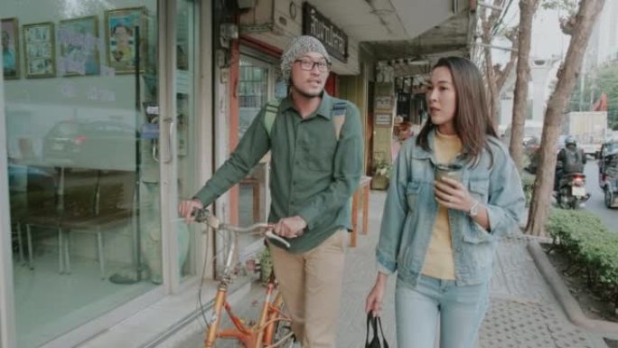 泰国夫妇在步行和骑自行车回家时的可持续生活方式。