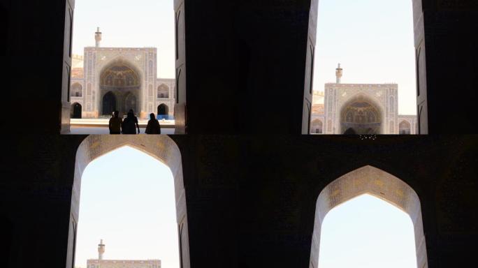 伊朗伊斯法罕-5月15日，2022: 一群导游探索庭院星期五清真寺 (伊斯法罕贾梅清真寺)