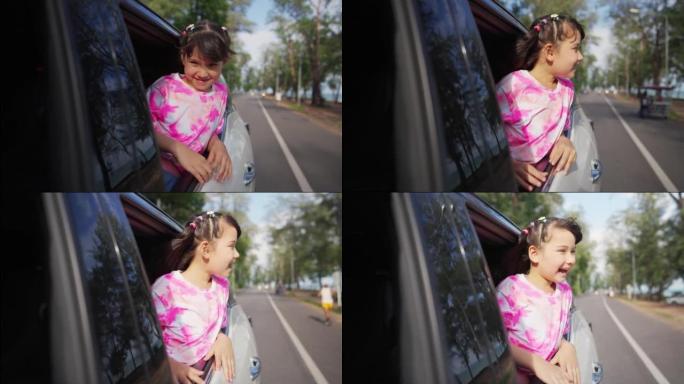 4k快乐的亚洲小女孩在夏季公路旅行假期中与家人一起享受和娱乐。