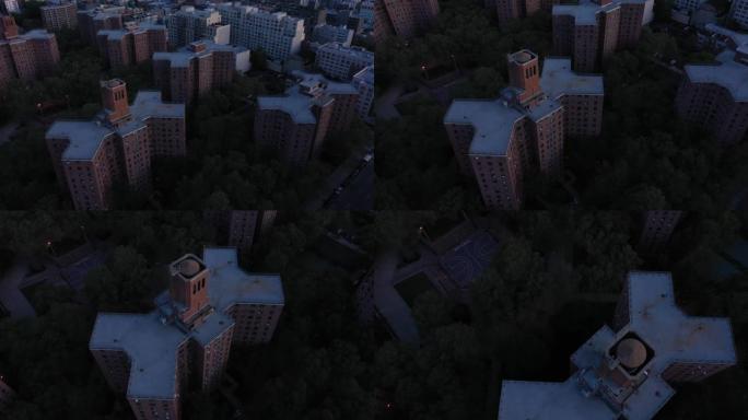 日出时，航拍镜头降落到纽约市哈林区住房项目的篮球场