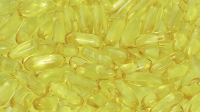 欧米茄3鱼油药丸背景。鱼油丸，黄色软胶囊Omega-3。天然补充剂