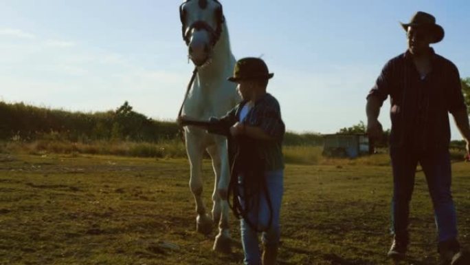 Experienced elderly male farmer teaching little so