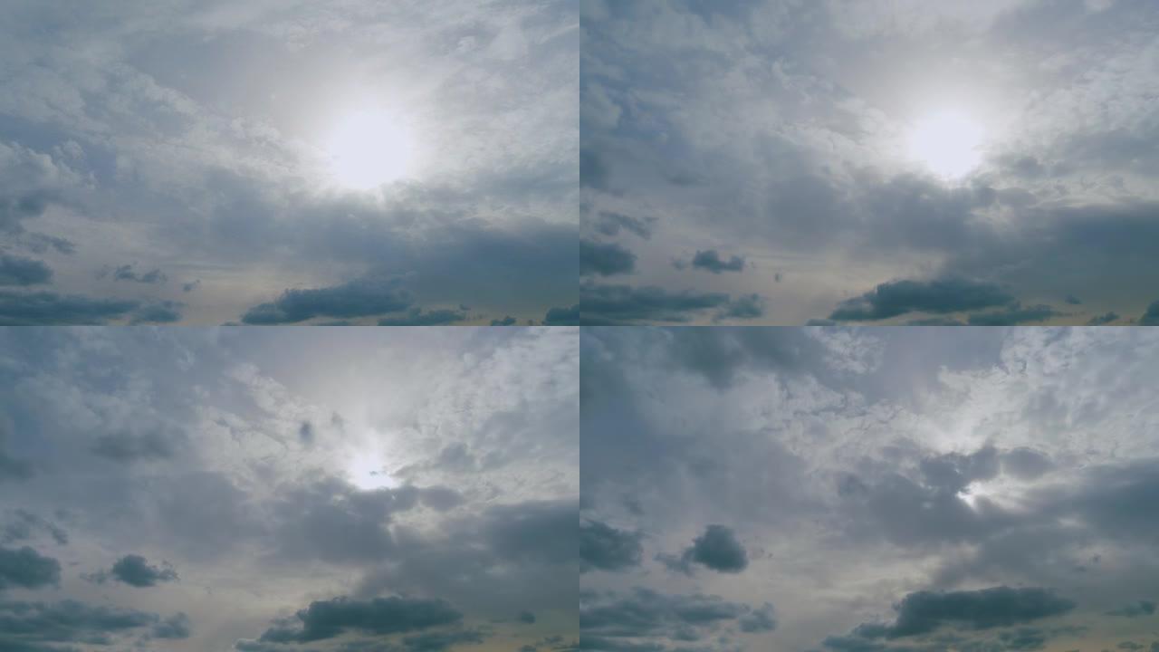 蓝天下的云和阳光。太阳光线令人叹为观止的云层。时间流逝。