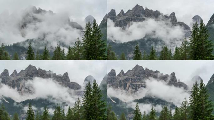 延时的日落场景，云朵在意大利白云岩的杉树上移动。