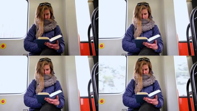 通勤火车上的年轻高加索女性阅读书提高了个人时间管理的效率