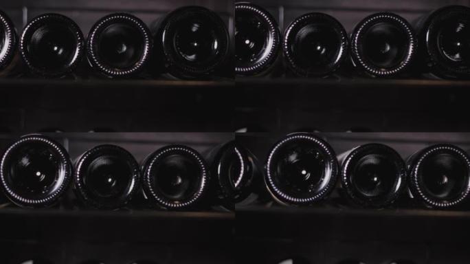 用相机关闭，在酒窖中移动4k的许多葡萄酒瓶，看到餐厅收藏的架子和成排的豪华红酒，用于庆祝和节日。