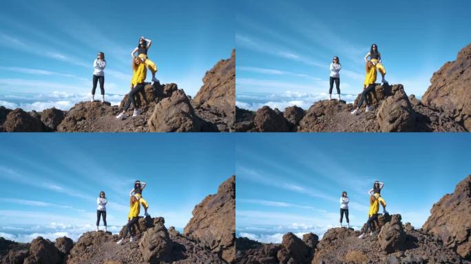 一群游客在特内里费岛的泰德火山国家公园中穿过凝固的熔岩山脉