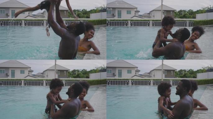 非洲家庭，父亲和母亲在度假游泳池里有小男孩