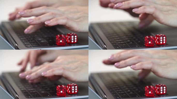 商人用红色骰子在键盘上打字的手