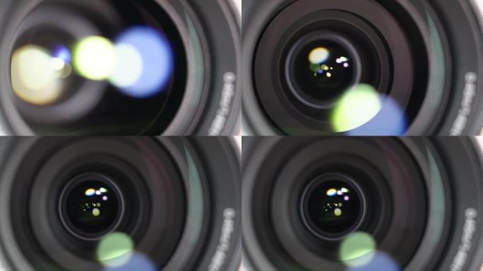 光学玻璃上有光斑的相机镜头的宏观拍摄。变焦相机镜头