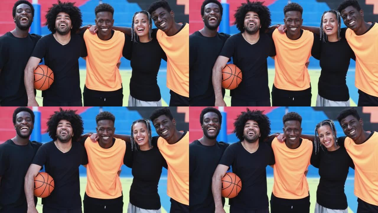 多种族的人在城市中互相拥抱-篮球队在镜头前微笑