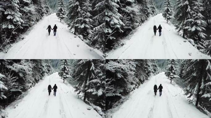 在大雪覆盖的高大圣诞树中，两个相爱的人在路上散步。