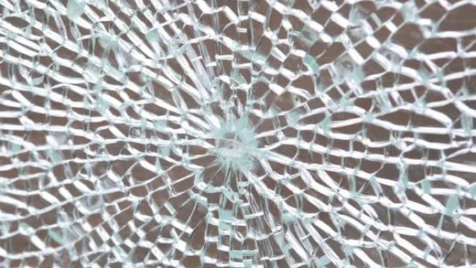 破碎的钢化玻璃抽象背景纹理，破碎的玻璃窗物体结构，弹孔宏观细节极端特写，没有人。损坏的玻璃窗格面板简