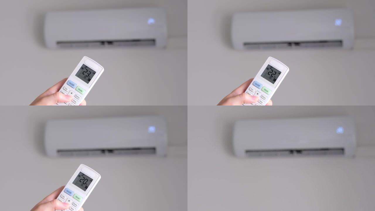 使用遥控器在空调上设置舒适的空气温度。慢动作