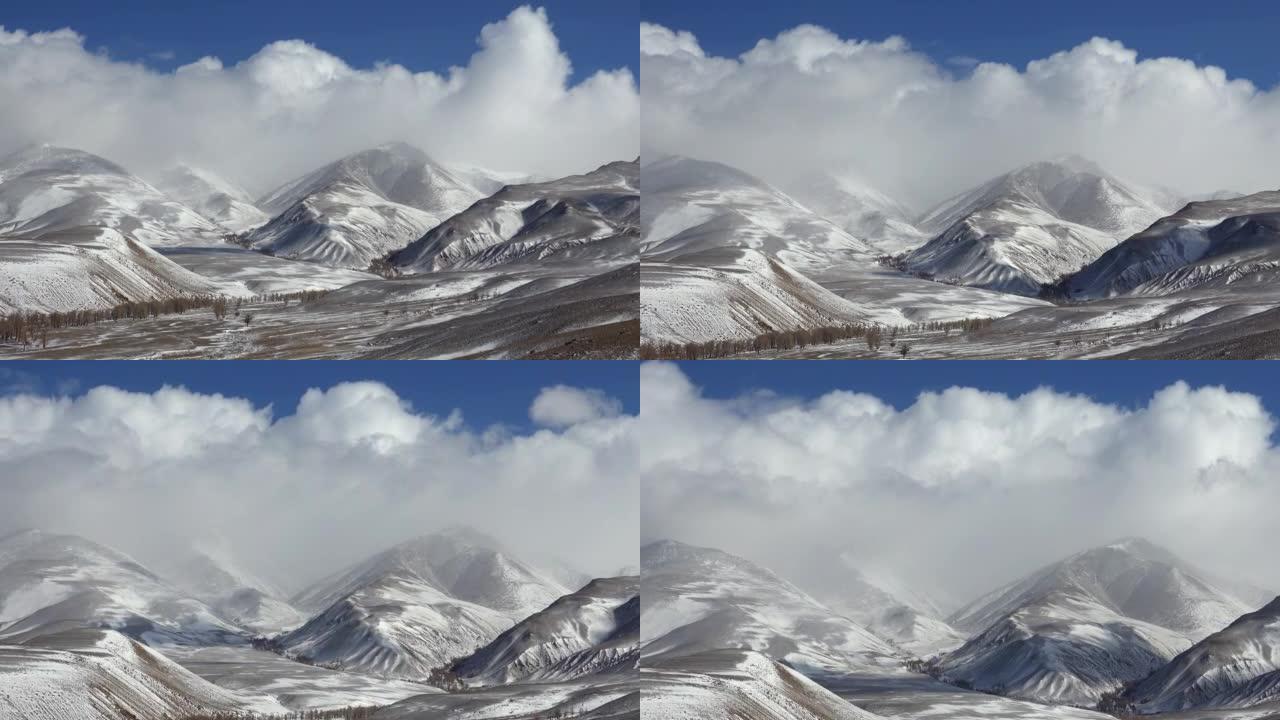 早春季节，库雷山脉的延时视频，蓝天上的云朵。阿尔泰、西伯利亚、俄罗斯