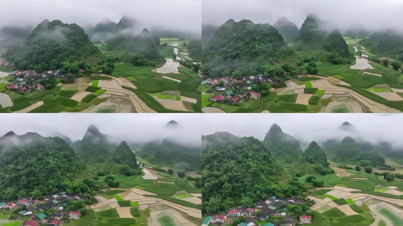 越南北部汽车邦省奇怪形状的村庄和稻田周围移动云雾的空中无人机超延时