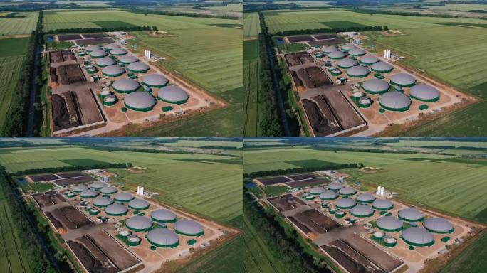 现代农业企业绿色燃料生产工厂。未来的沼气综合体位于广阔的田野中。空中透视。