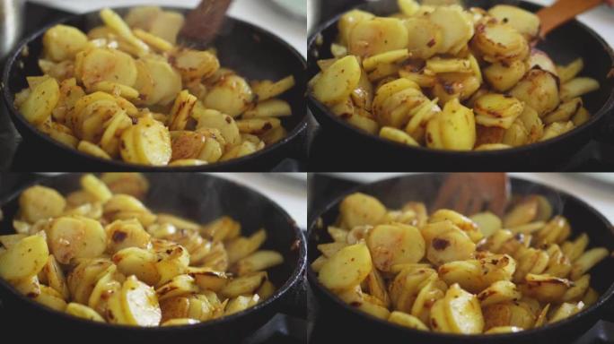 新土豆在平底锅里油炸。脆皮炸土豆。家中的天然健康食品。