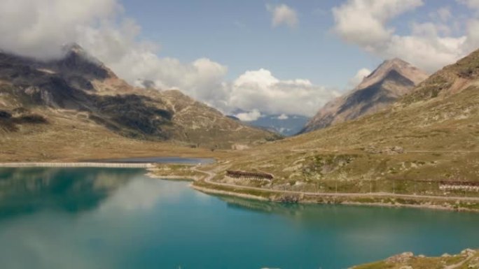无人驾驶飞机鸟瞰图令人惊叹的瑞士山湖景观。无人机在阿尔卑斯山原始景观上方飞行