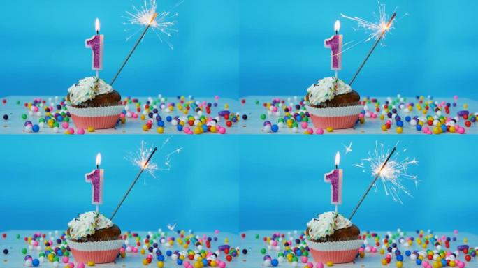 祝一岁的孩子生日快乐，生日蛋糕上有蜡烛和蓝色的背景装饰。本空间
