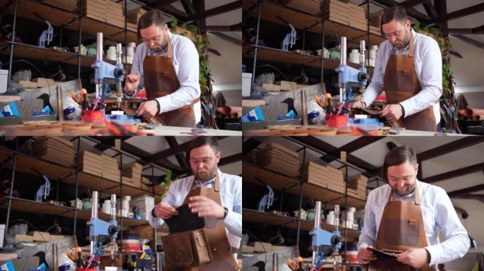 高加索男性裁缝在裁缝车间制作皮包