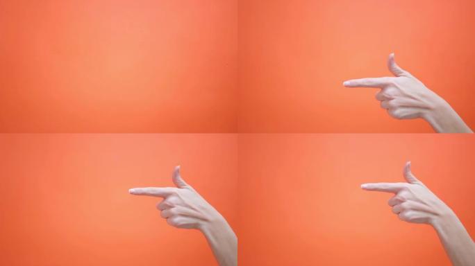 女人在孤立的红色背景上抬起拇指，然后将食指指向4k。手势，工作室。广告。批准。好心情，支持，国际签