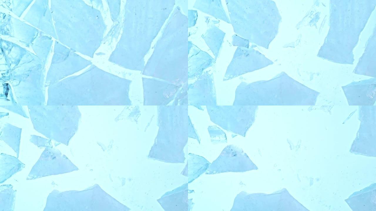 蓝色背景上分离的落冰板块的超慢动作。