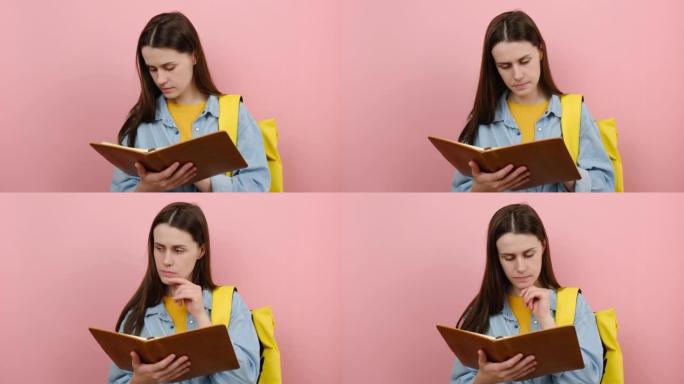 20多岁的少女学生肖像穿着衬衫和黄色背包阅读书籍《思考梦想》，在工作室的粉色背景墙上孤立地摆姿势。高