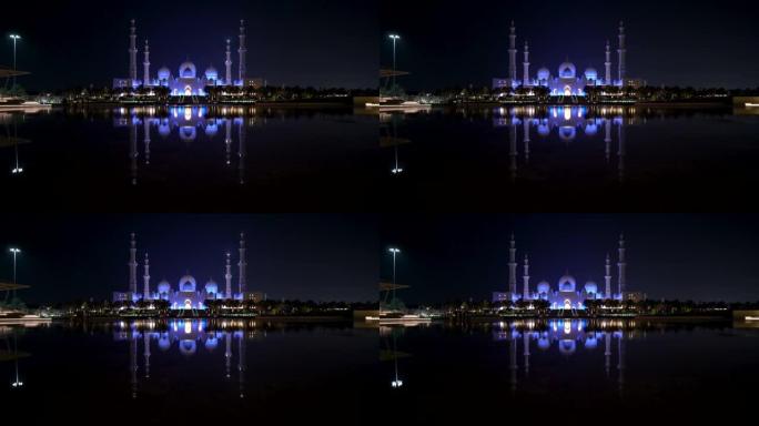 阿拉伯联合酋长国阿布扎比著名的大清真寺晚上在游泳池里倒影