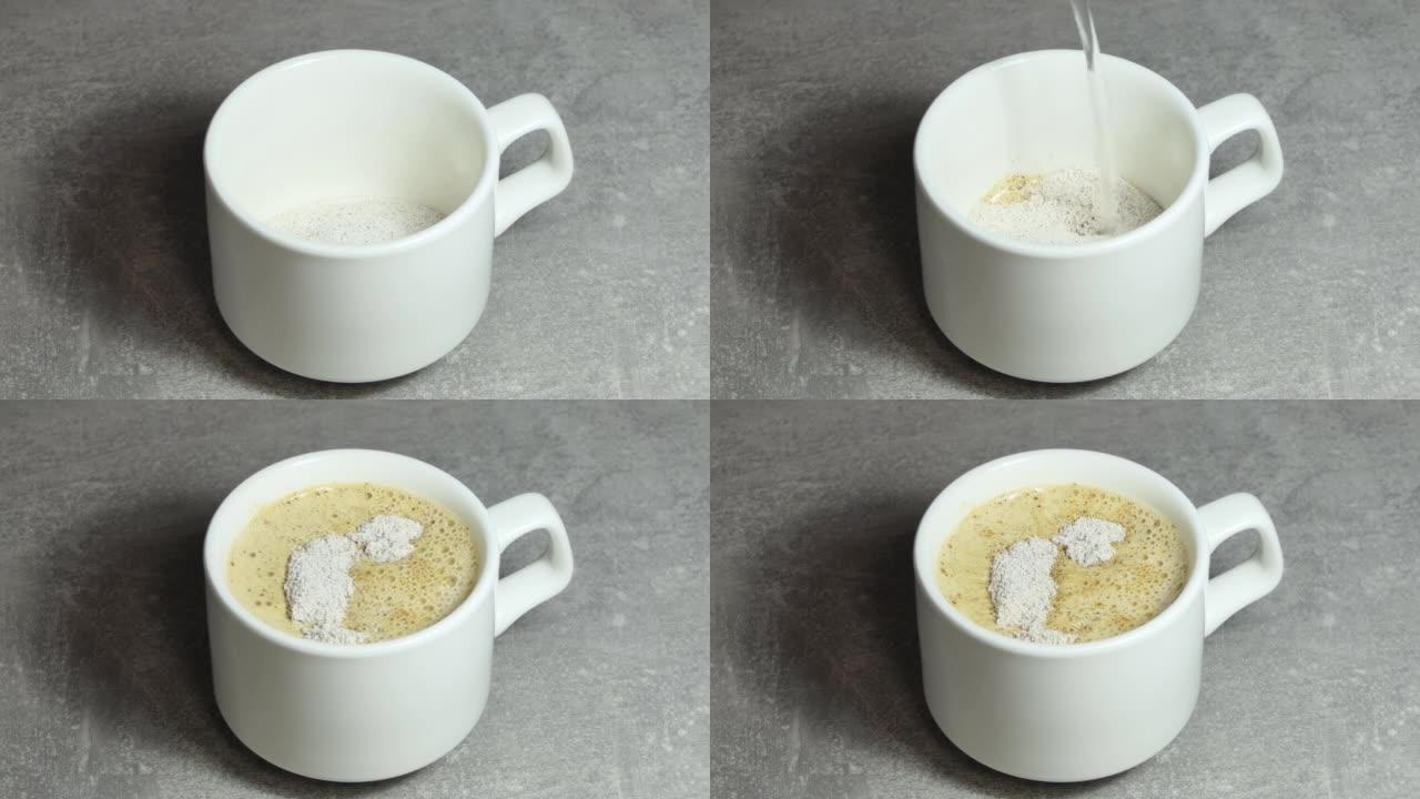 将速溶咖啡颗粒倒入白色杯子中，然后倒入开水，并在上面撒上巧克力。速溶咖啡。