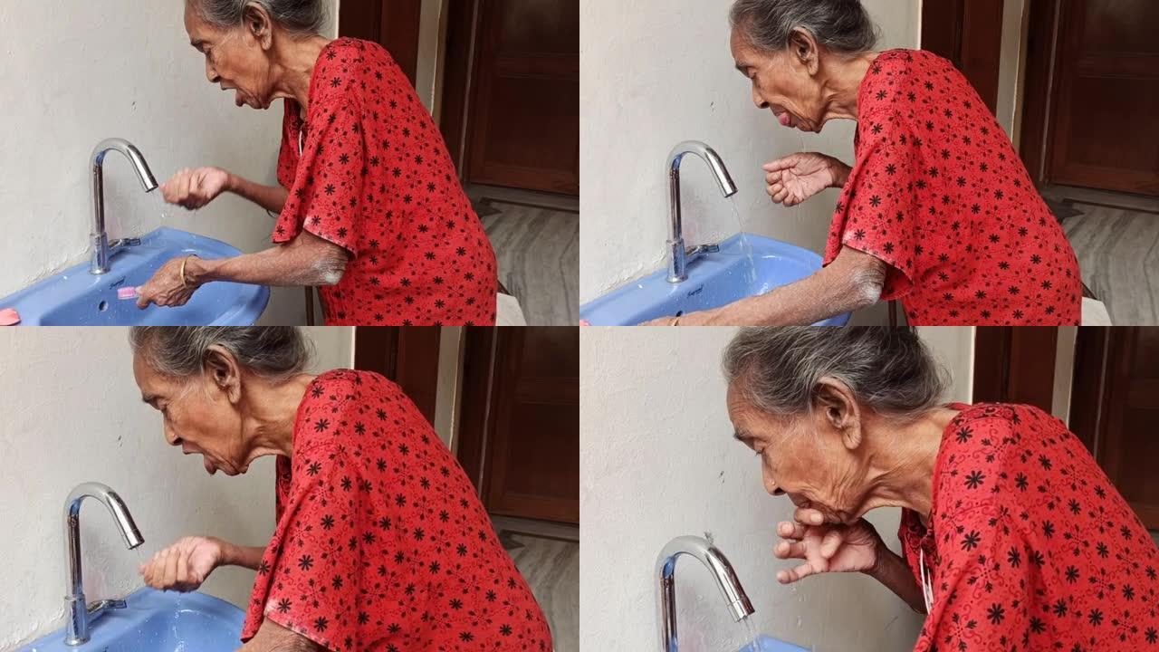 早上，一位老妇人正在刷牙