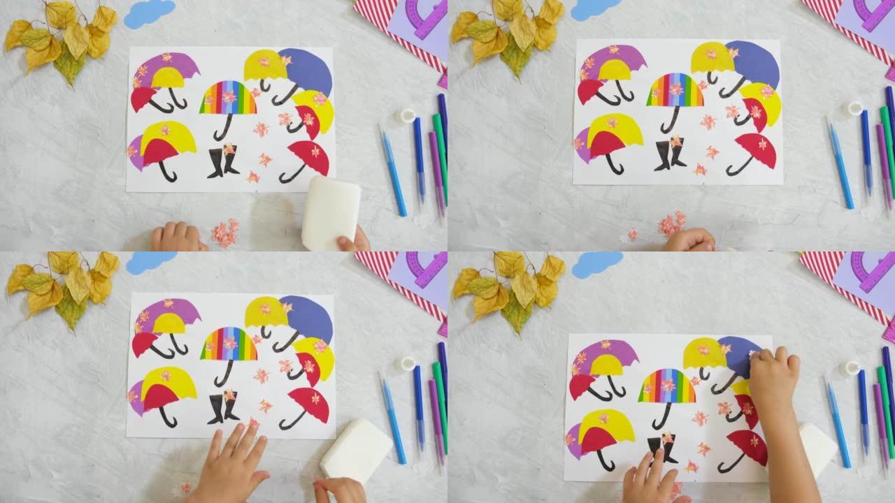 静物的秋天应用。孩子用纸剪出五颜六色的伞，给孩子们做工艺品。回到学校